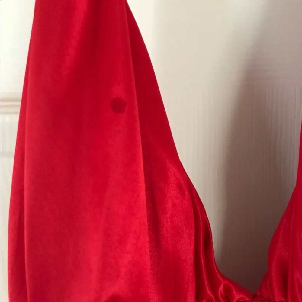 Short, halter red dress. Light beading